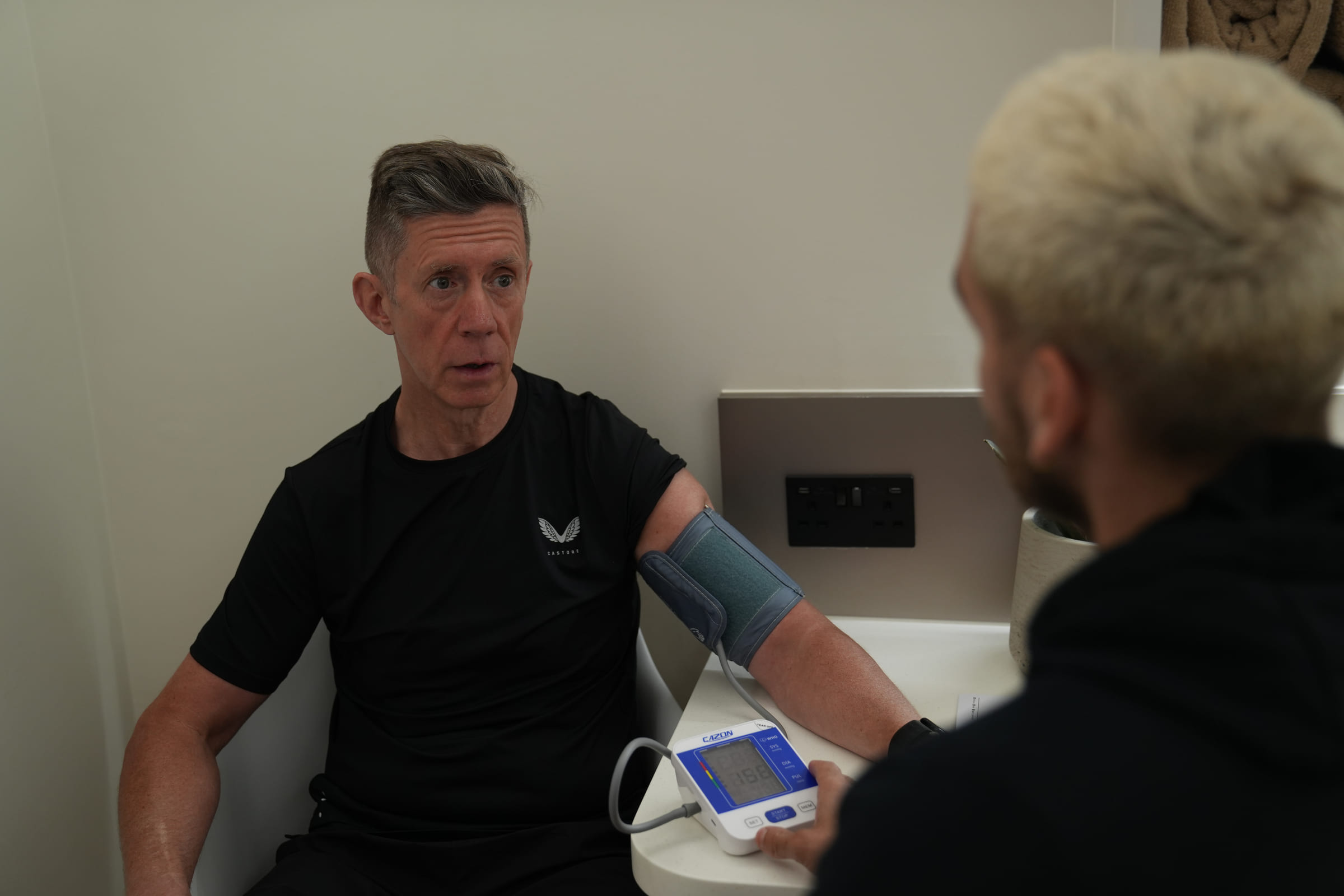 A client's blood pressure being taken at the start of the assessment