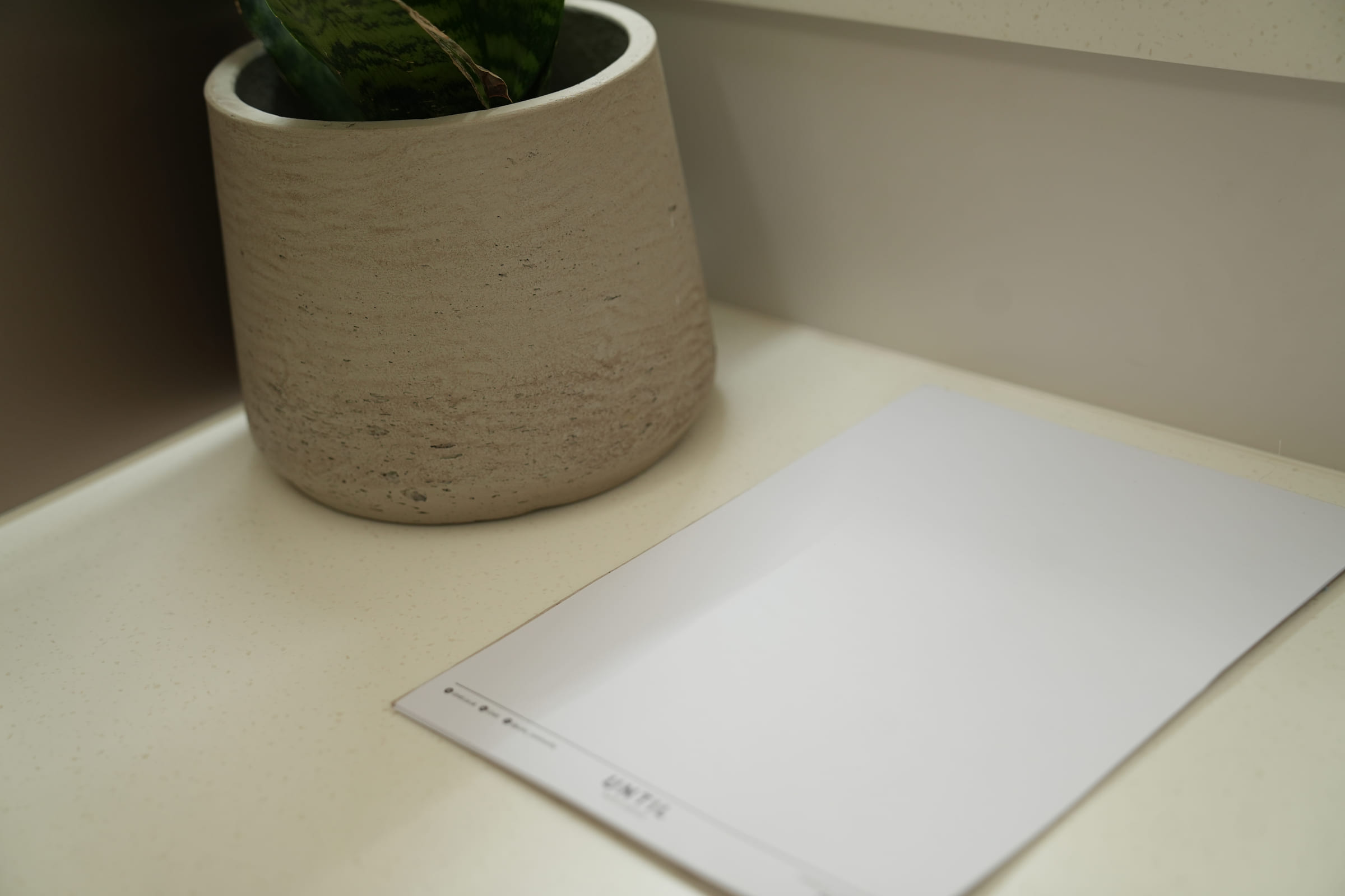 A notepad and pen on the consulting desk before a session